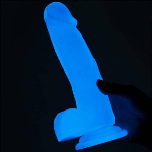 Dildo fluorescente con diseño realista y textura venosa, ideal para juegos en la oscuridad con estimulación intensa.